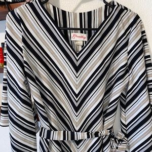 Very nice blouse made by Bradley. has bell sleeves and tie belt.
